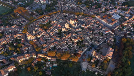 Beautiful-aerial-view-of-Uzès-sunrise-south-of-France-trees-around-the-center